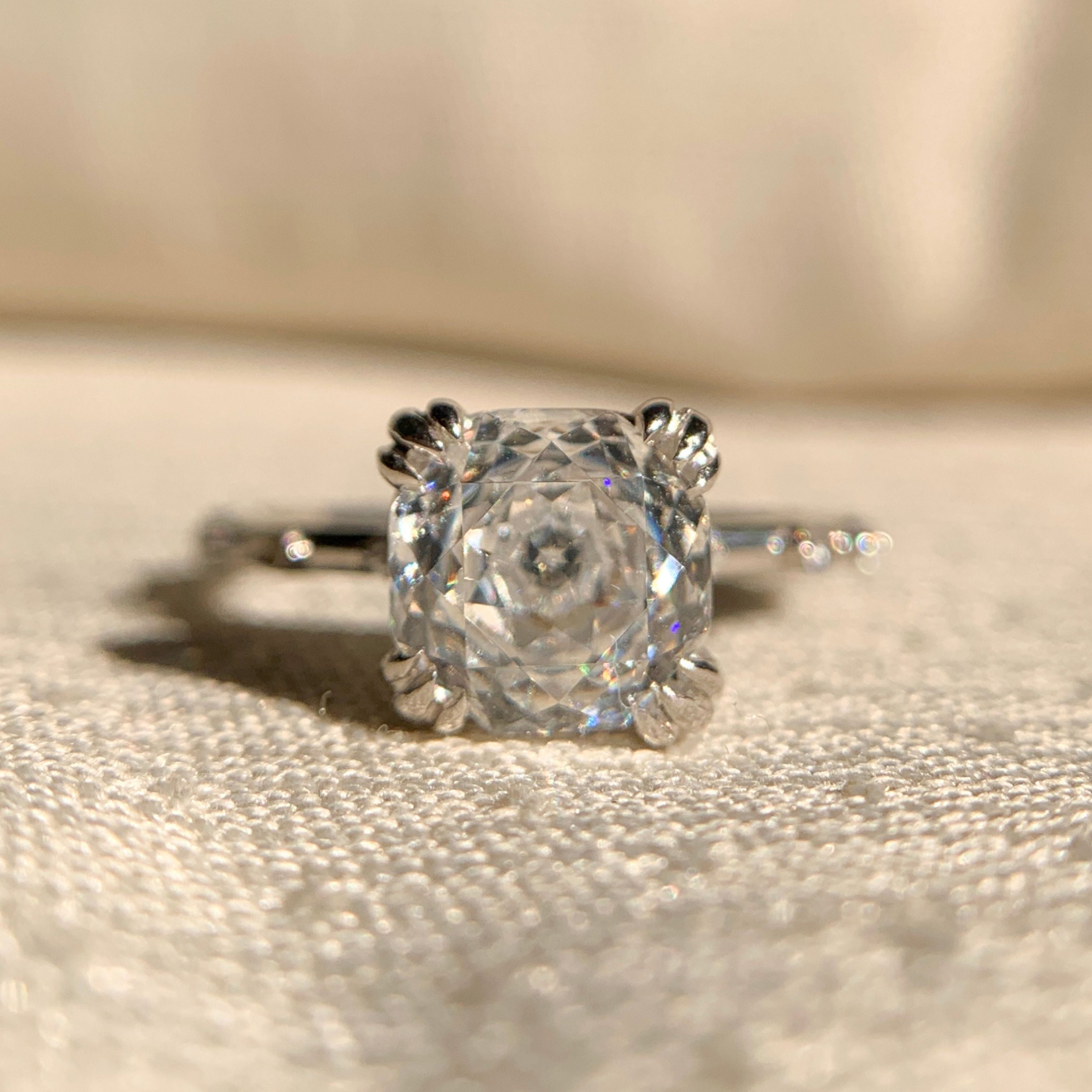 “Cushion cut double claw prong engagement ring in 14k white gold”